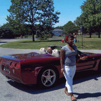 The smile on her face says the joy she had in riding in a Corvette convertible
